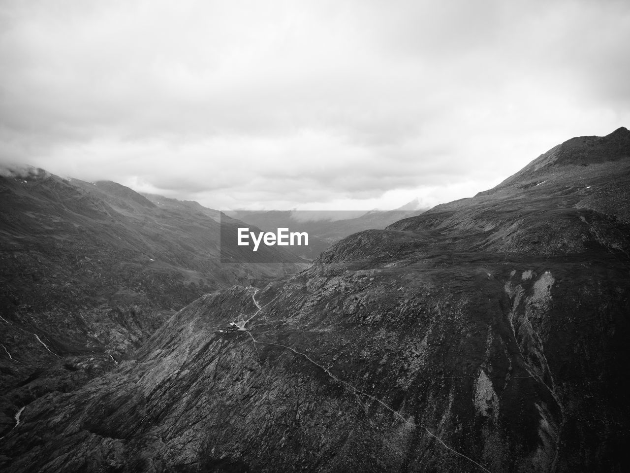 View of rocky mountains against sky