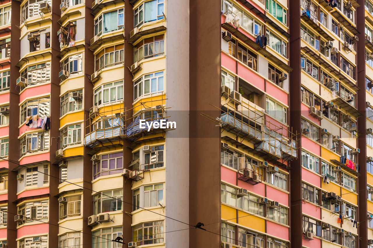 Close-up to a densely populated apartment building in hong kong.