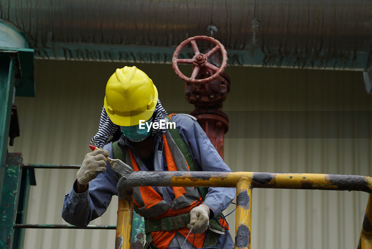 rear view of man working in workshop