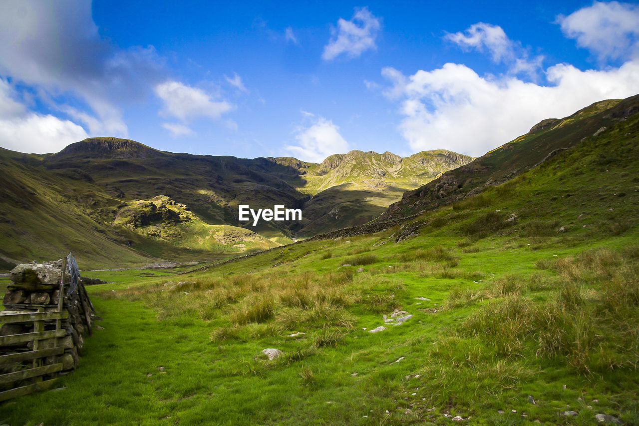 Scenic view of landscape and mountains against sky