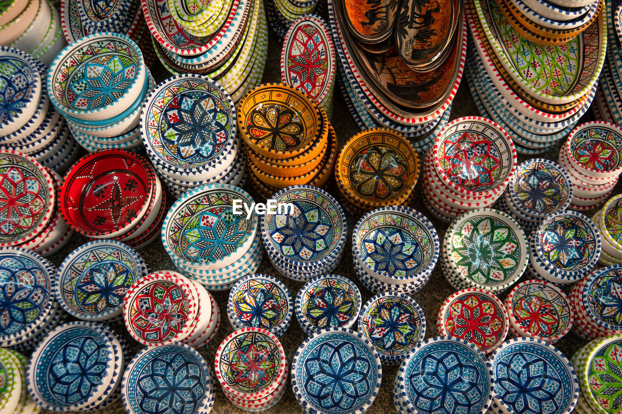 Tunisian ceramic tableware with multicoloured painting for sale in the market.