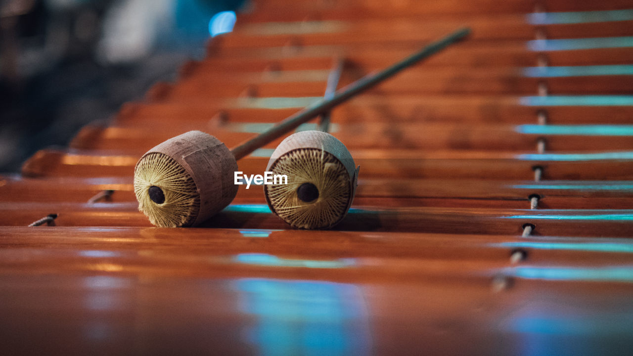 Close-up of mallets on wooden xylophone