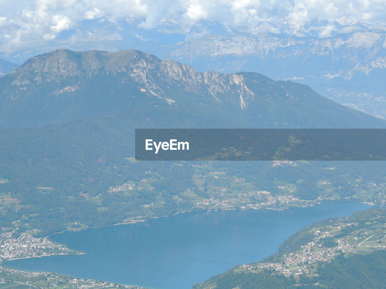 AERIAL VIEW OF SEA AND MOUNTAIN AGAINST SKY