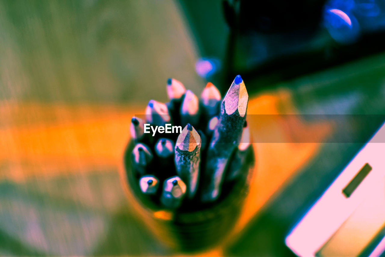 Close-up of multi colored pencils on table