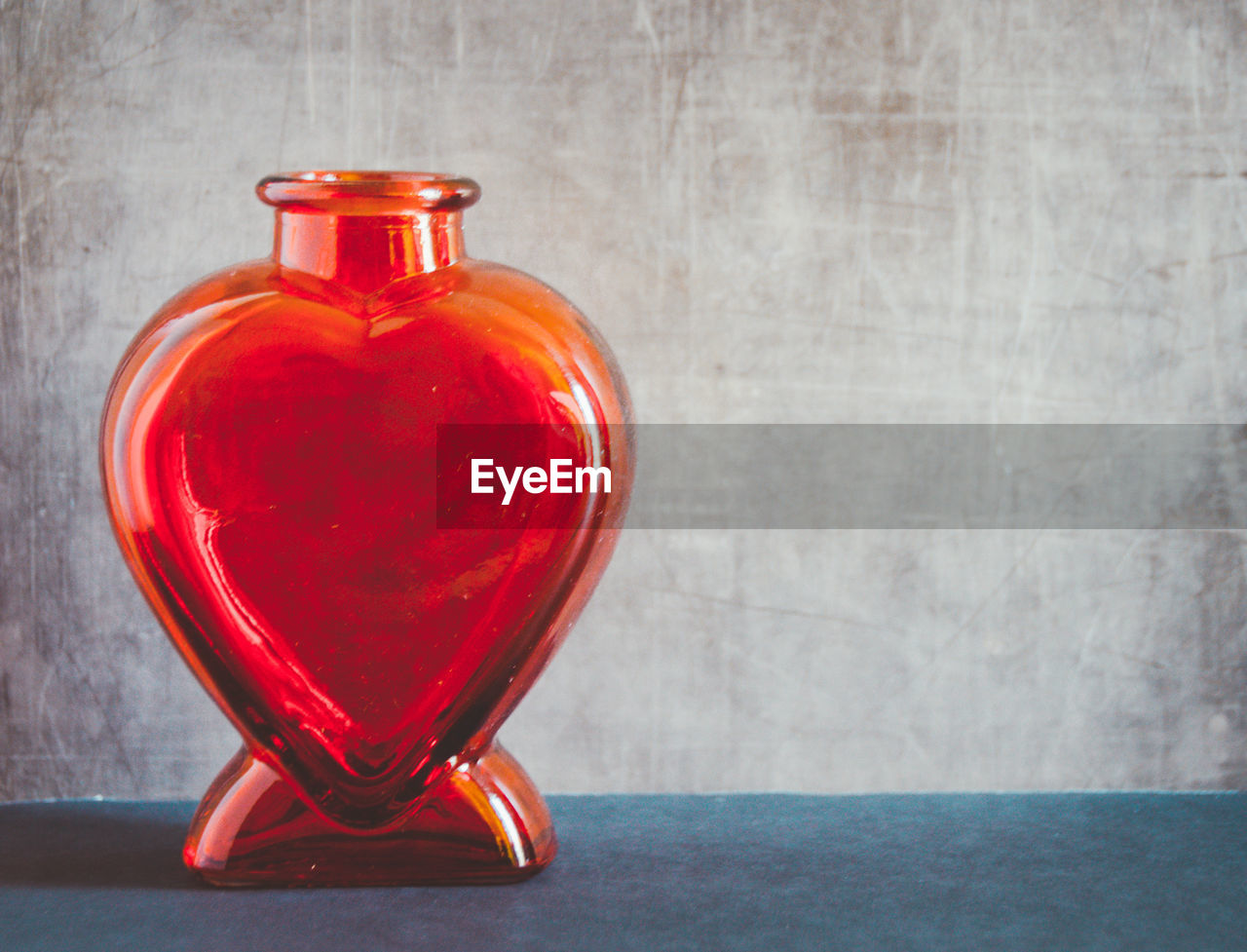 Close-up of red heart shape decoration on table