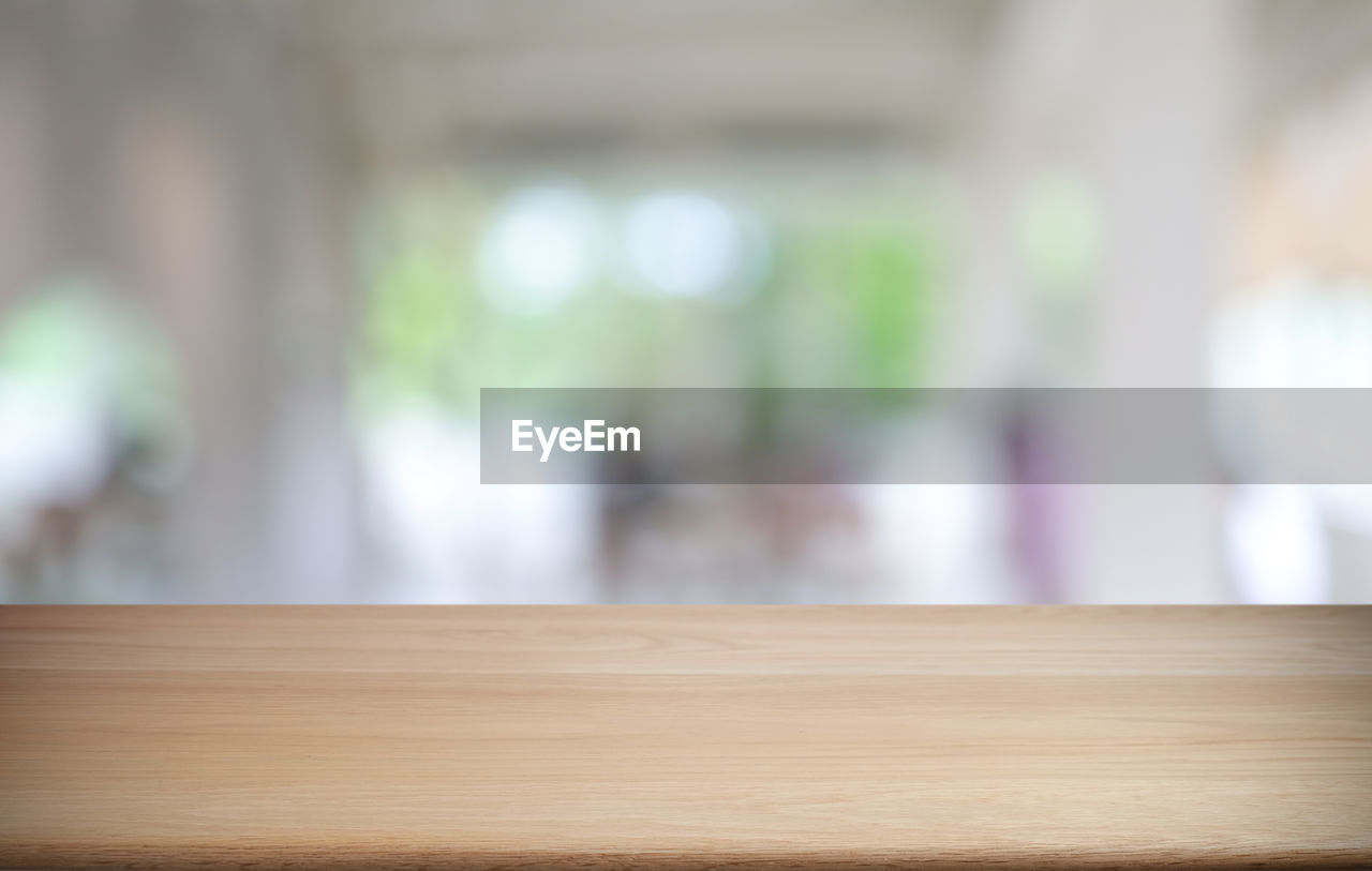 DEFOCUSED IMAGE OF A WOODEN TABLE