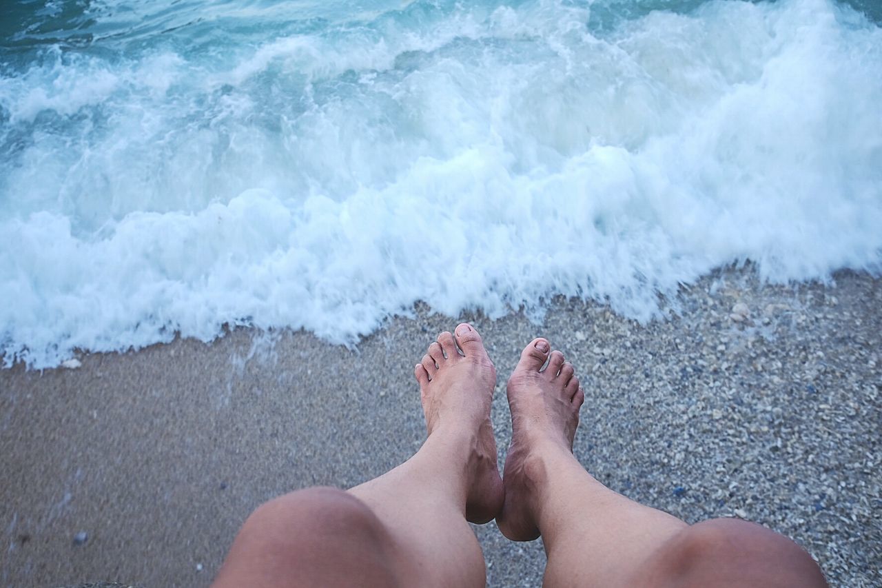 Low section of woman on beach