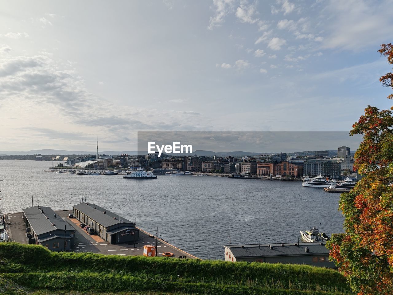 water, architecture, sky, built structure, transportation, building exterior, nature, cloud, sea, city, travel destinations, nautical vessel, building, travel, coast, mode of transportation, no people, tourism, plant, day, harbor, land, outdoors, shore, ship, body of water, vehicle, landscape, high angle view, cityscape, house, tree, holiday, beach, vacation, scenics - nature, beauty in nature, trip, environment, bridge, bay