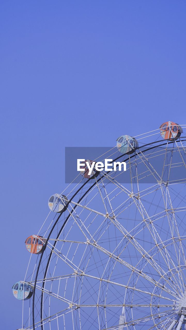 low angle view of metallic structure against clear blue sky