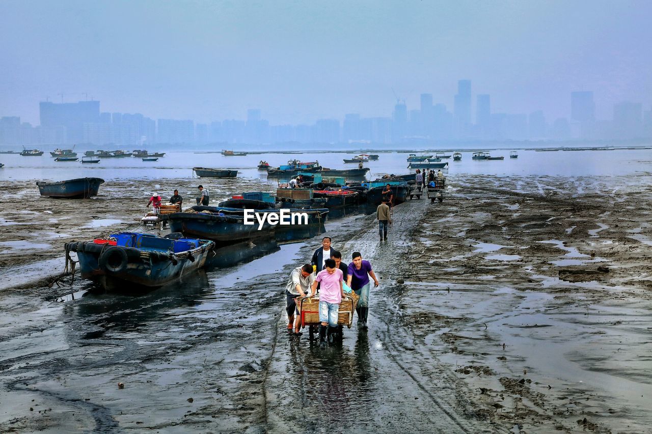 PEOPLE ON BOAT IN SEA