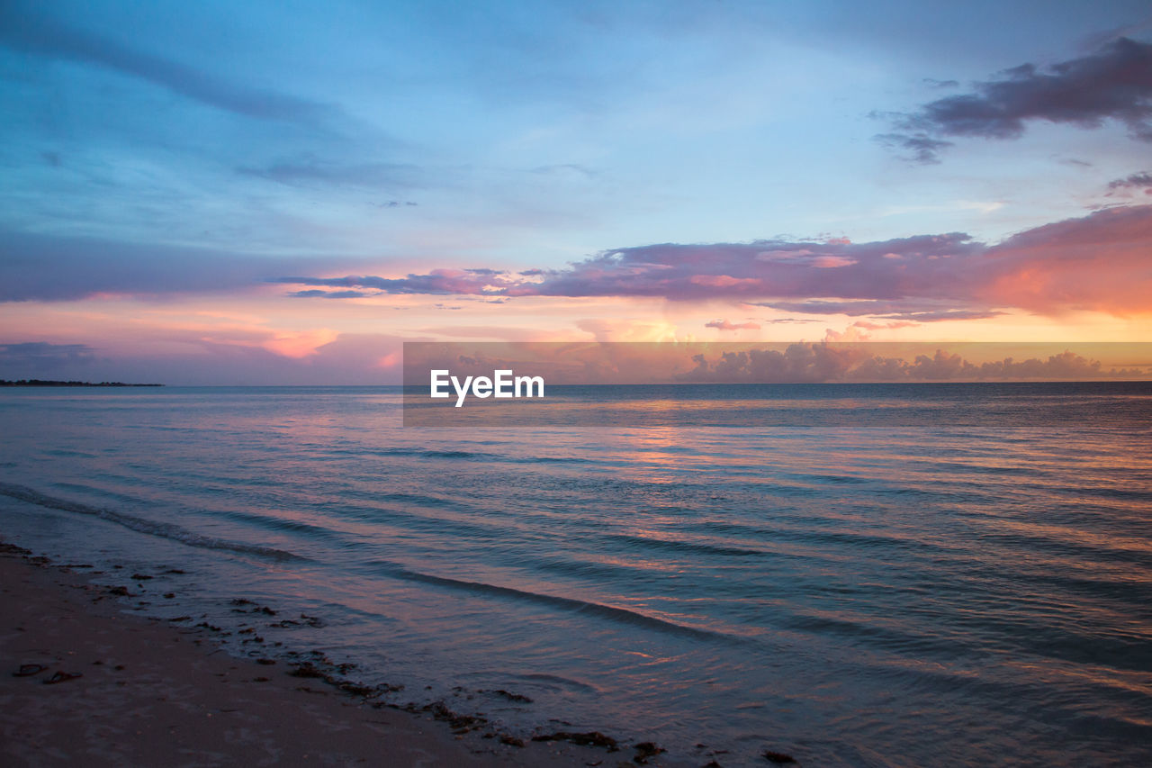 Scenic view of sea against sky at sunset