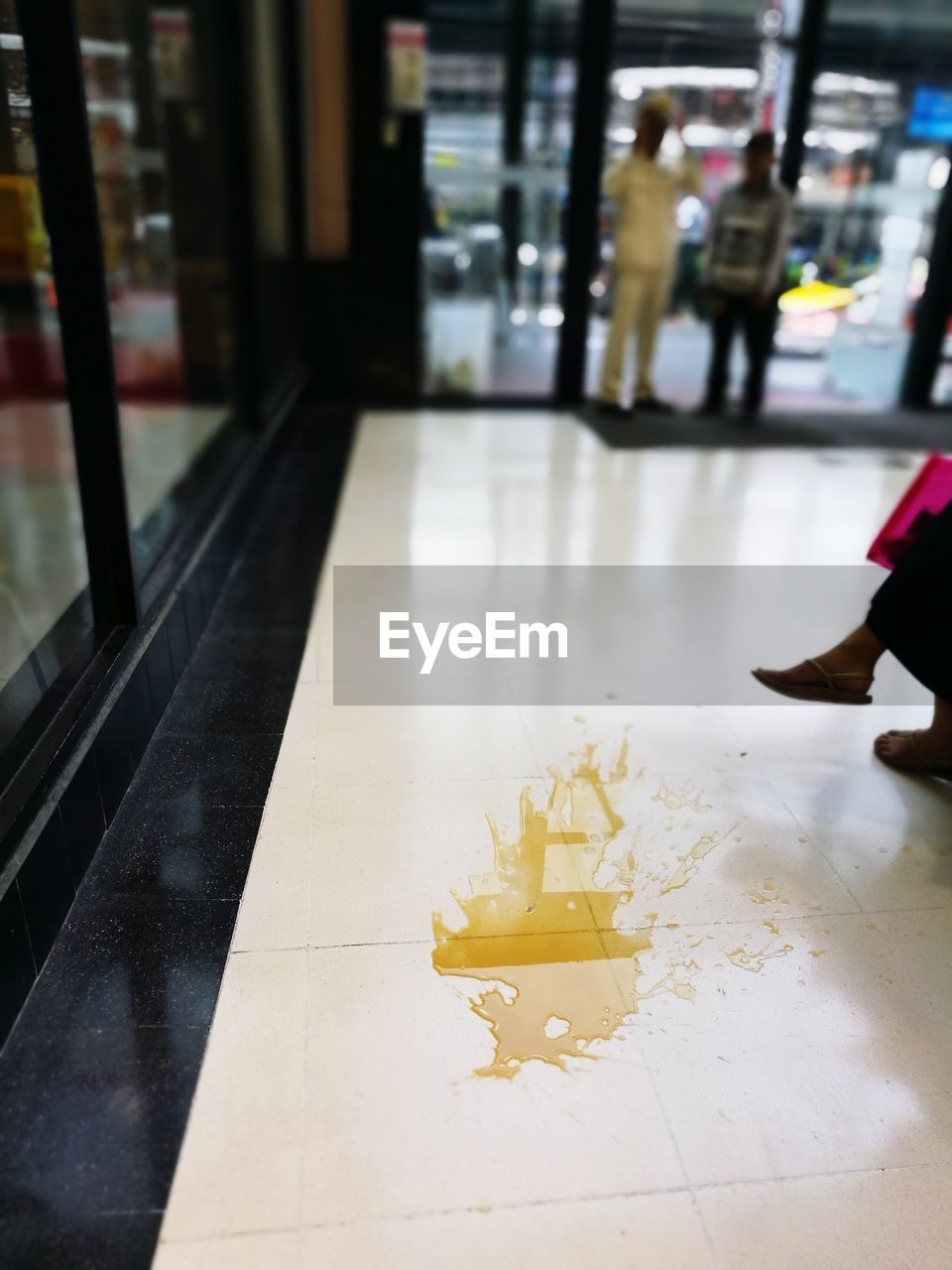 CLOSE-UP LOW SECTION OF MAN ON FLOOR