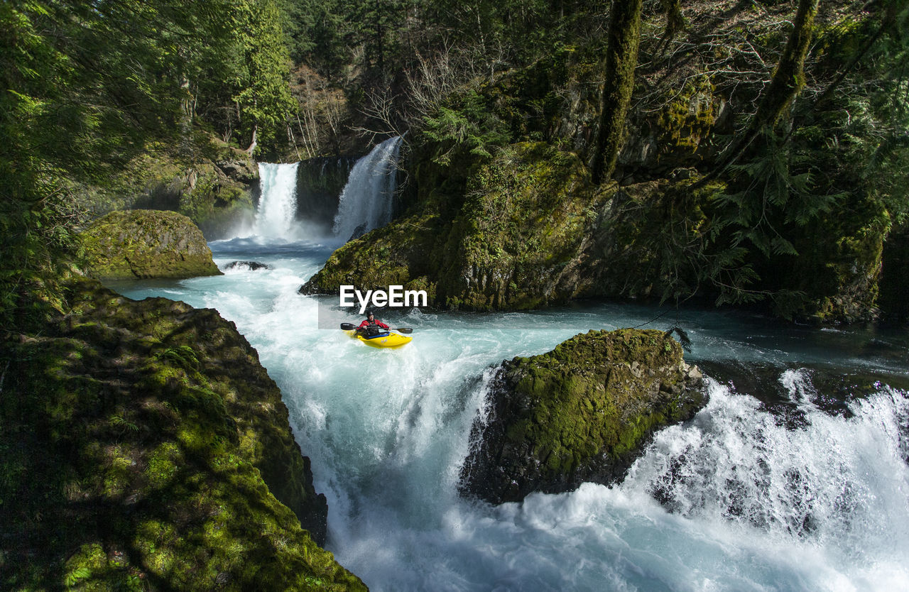 A kayaker descends the little white salmon river in wa.
