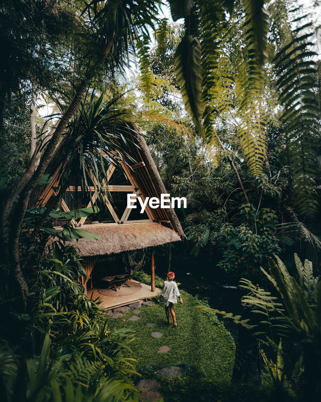 High angle view of woman walking towards villa