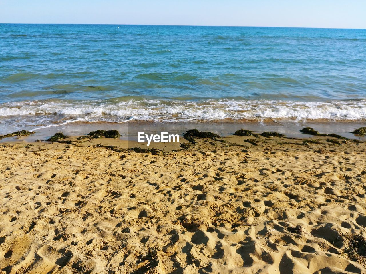 VIEW OF BEACH AGAINST SKY