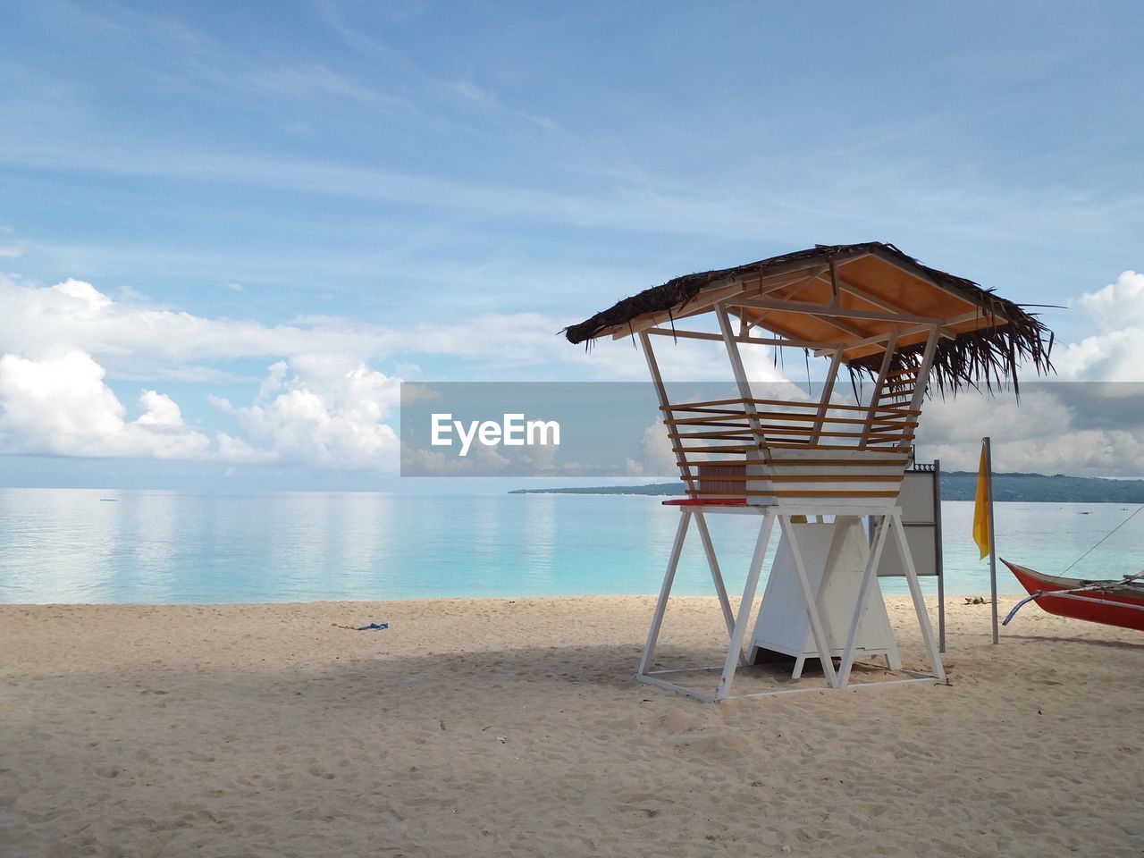 GAZEBO ON BEACH AGAINST SKY