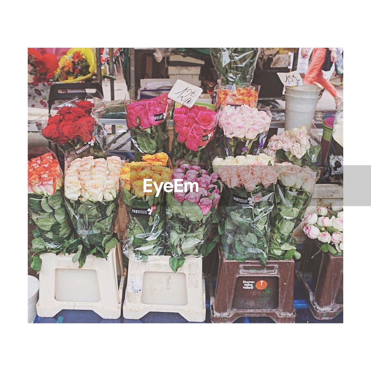 Multi colored roses bouquets in market stall