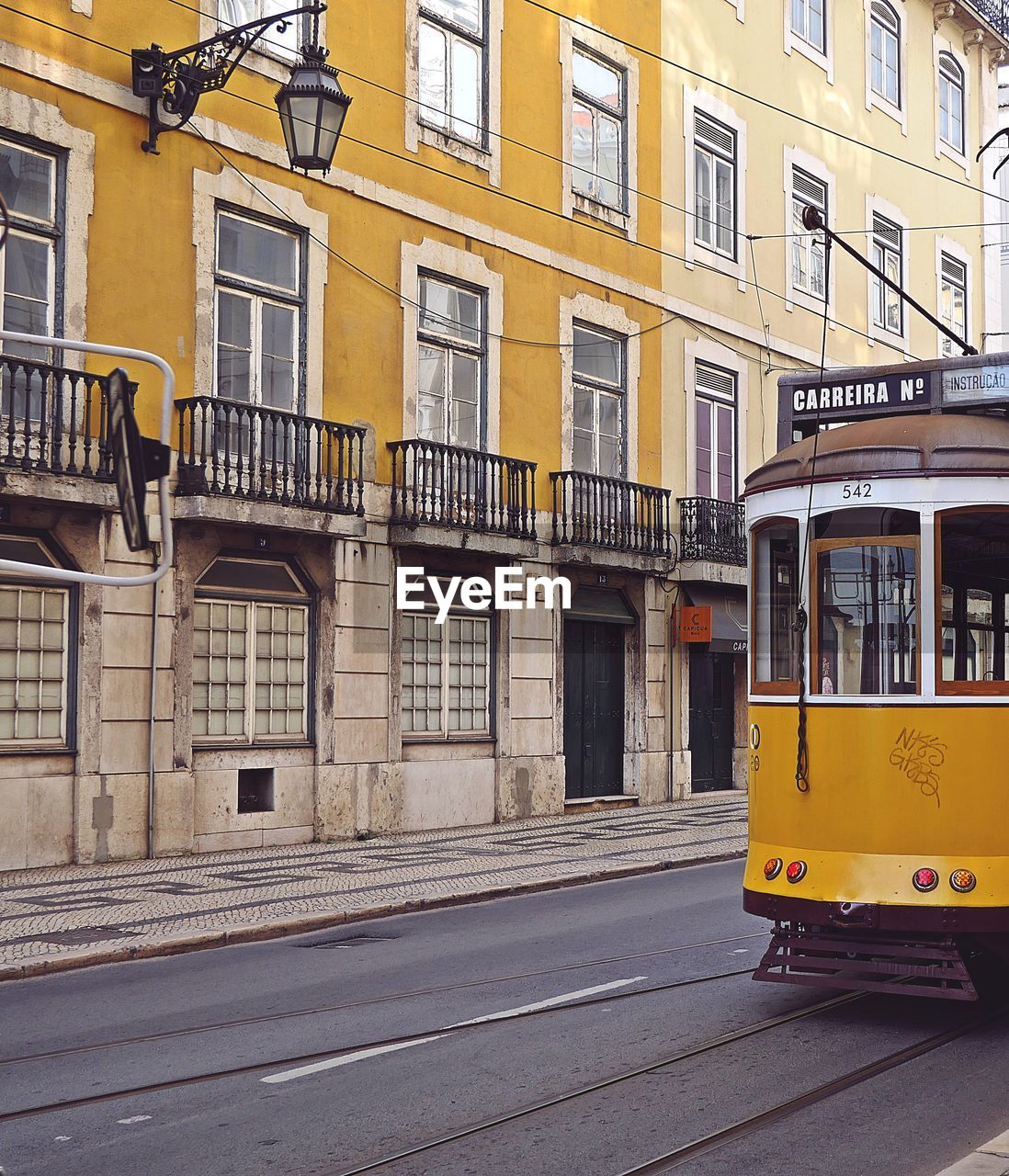 YELLOW STREET BY BUILDINGS