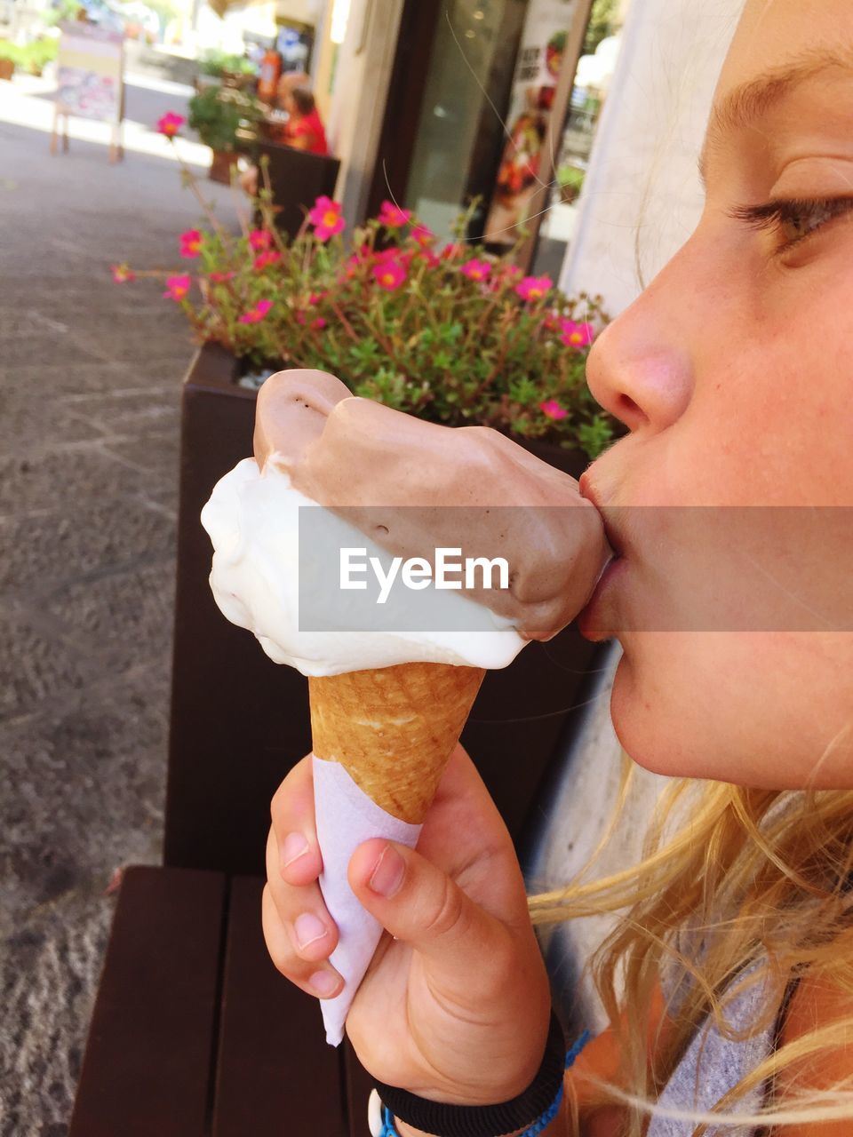 close-up of young woman holding ice cream