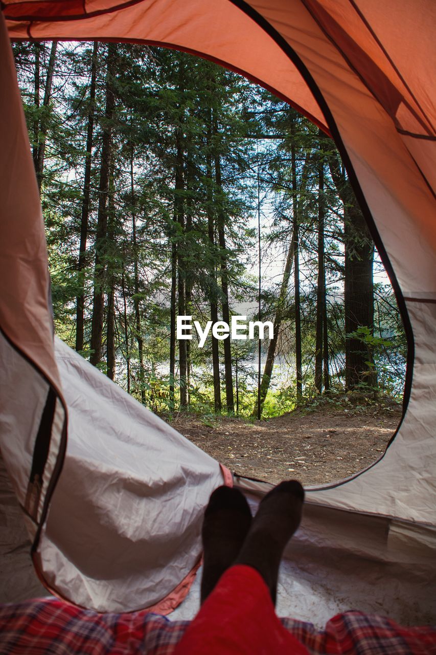 LOW SECTION OF MAN RESTING ON FIELD