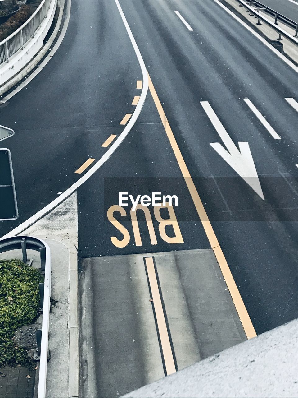 High angle view of road sign on city street