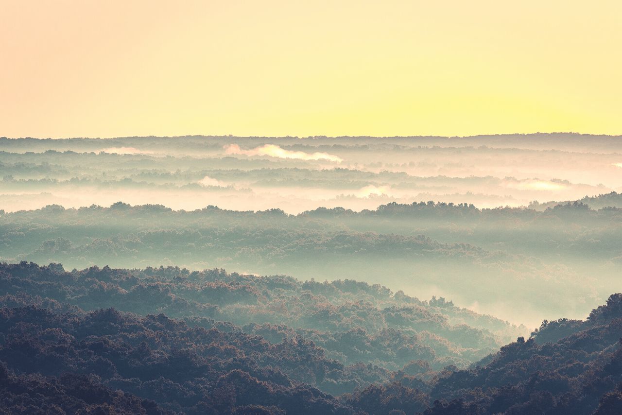 SCENIC VIEW OF LANDSCAPE AGAINST SKY AT MORNING