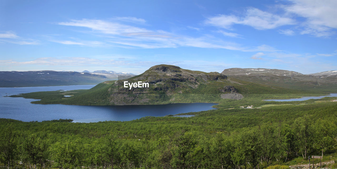 lake, water, highland, scenics - nature, environment, mountain, landscape, sky, land, beauty in nature, nature, plant, wilderness, cloud, reservoir, no people, travel destinations, tranquility, travel, tranquil scene, non-urban scene, body of water, grass, beach, outdoors, tree, tourism, day, blue, mountain range, green, coast, forest, plateau, idyllic, coastline, volcano