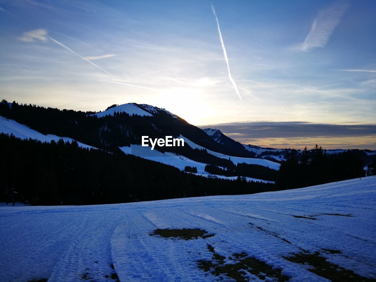 Scenic view of mountains against sky during winter