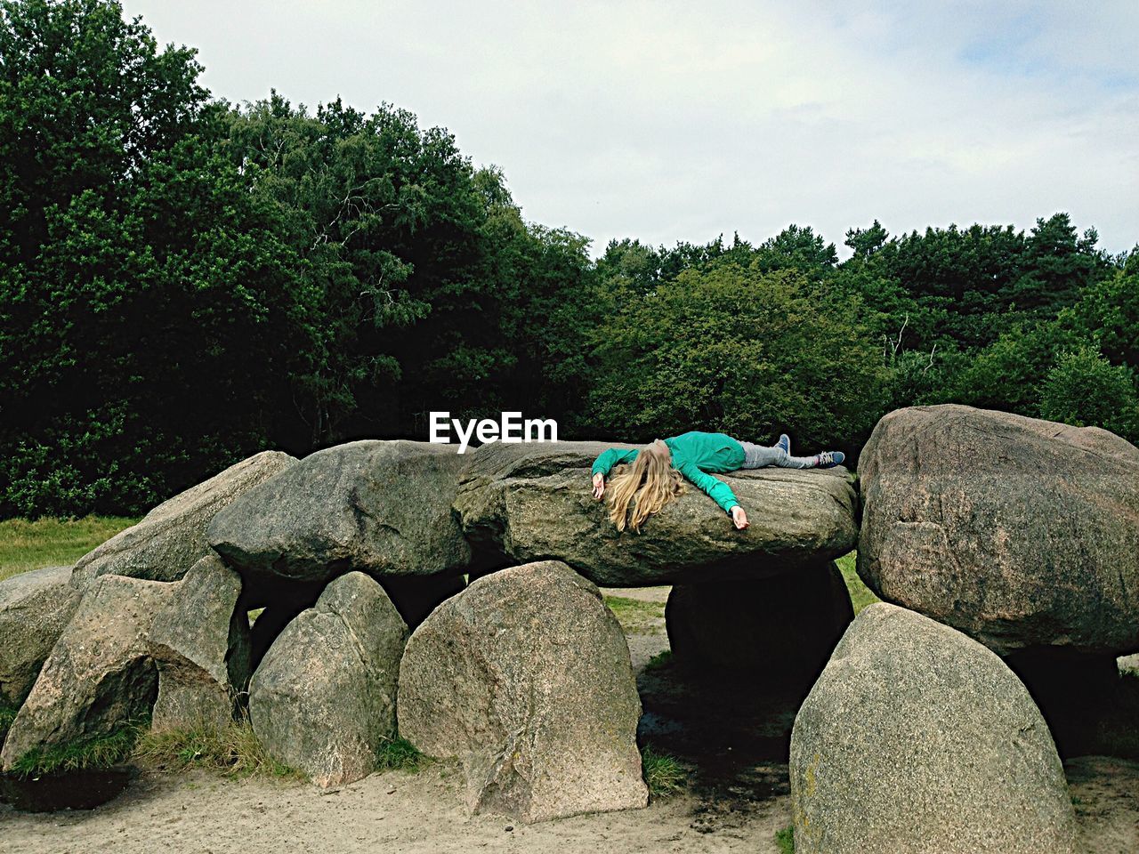 Woman relaxing on rocks at havelte