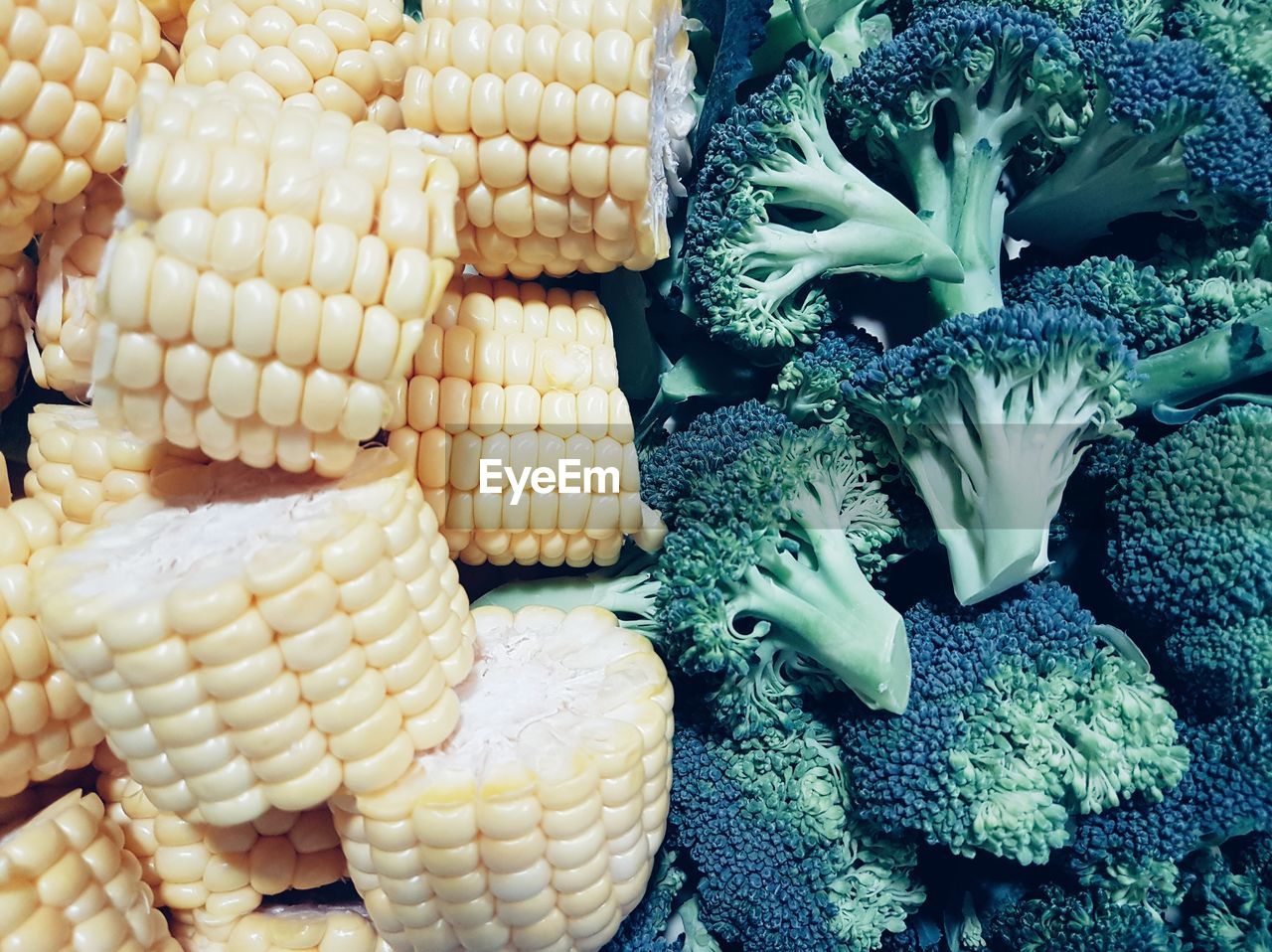 High angle view of broccoli and corns for sale