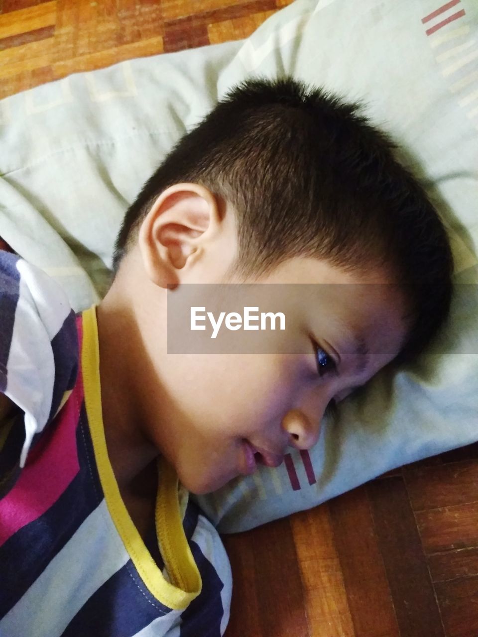 HIGH ANGLE VIEW PORTRAIT OF BABY SLEEPING ON BED