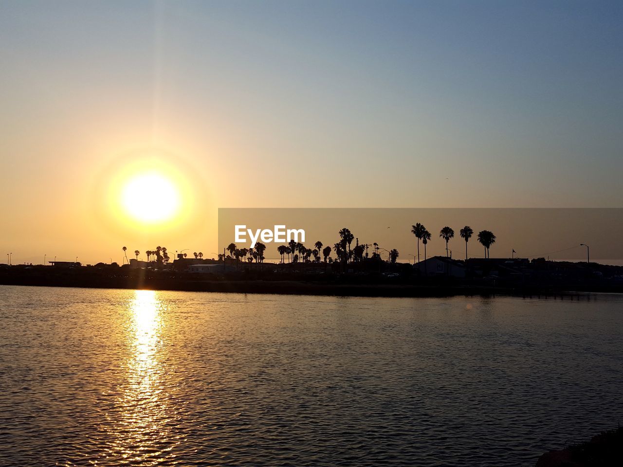 SUNSET OVER CALM SEA