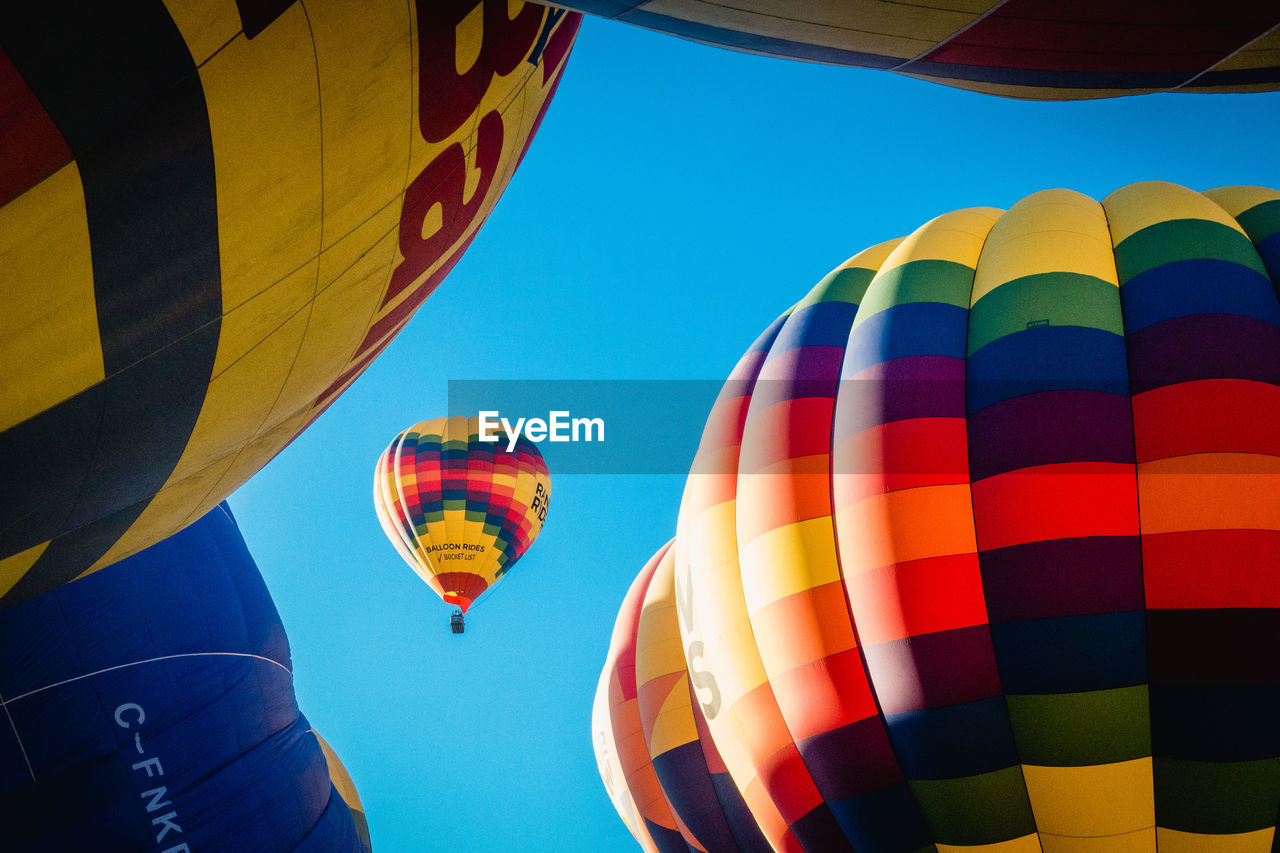 LOW ANGLE VIEW OF COLORFUL HOT AIR BALLOON AGAINST SKY