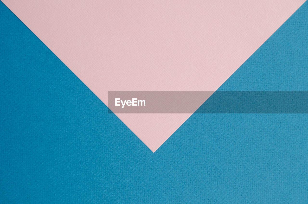 Close-up of blue and pink paper