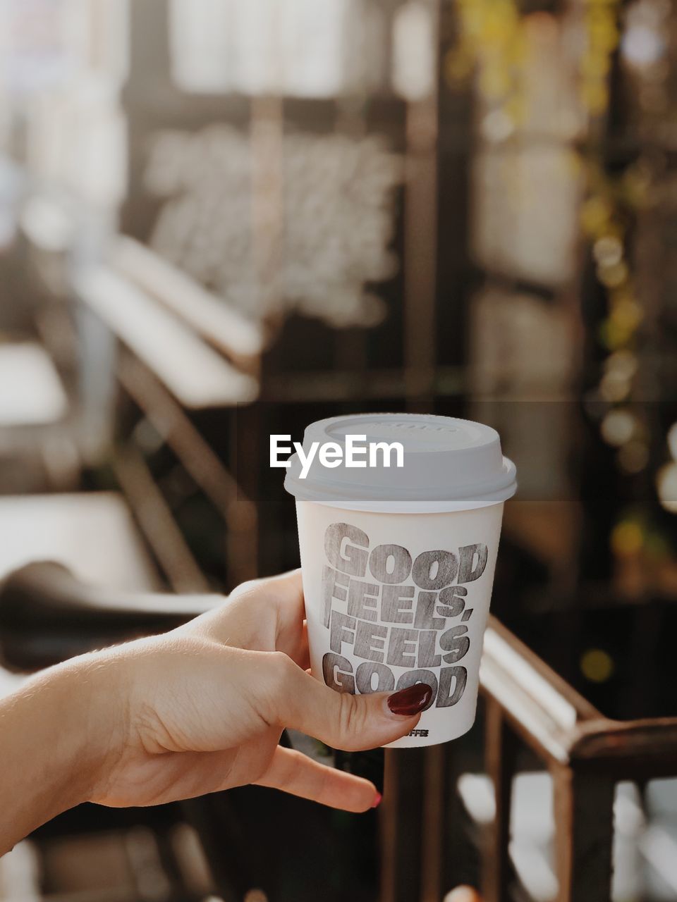 Close-up of woman holding coffee cup