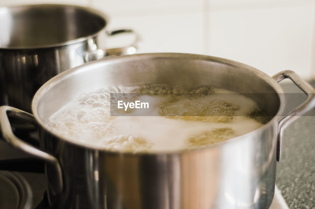 Close-up of food boiling in utensil at kitchen