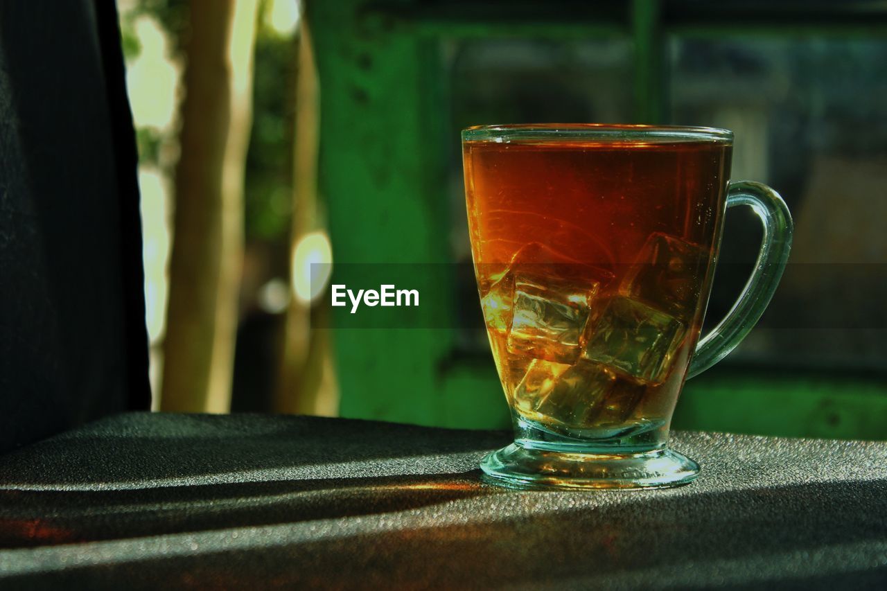 Close-up of tea in glass on table