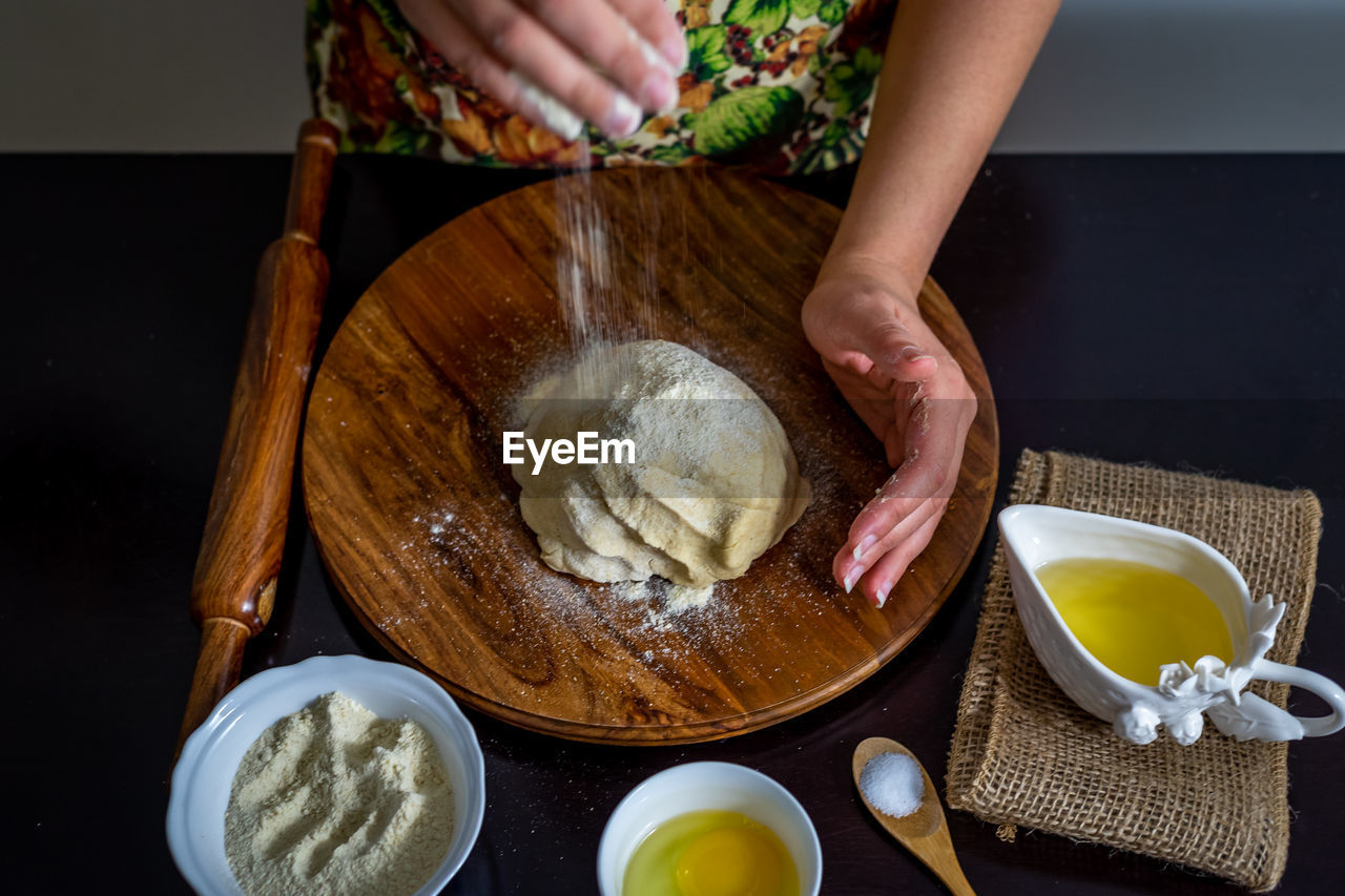 MIDSECTION OF WOMAN HAVING FOOD