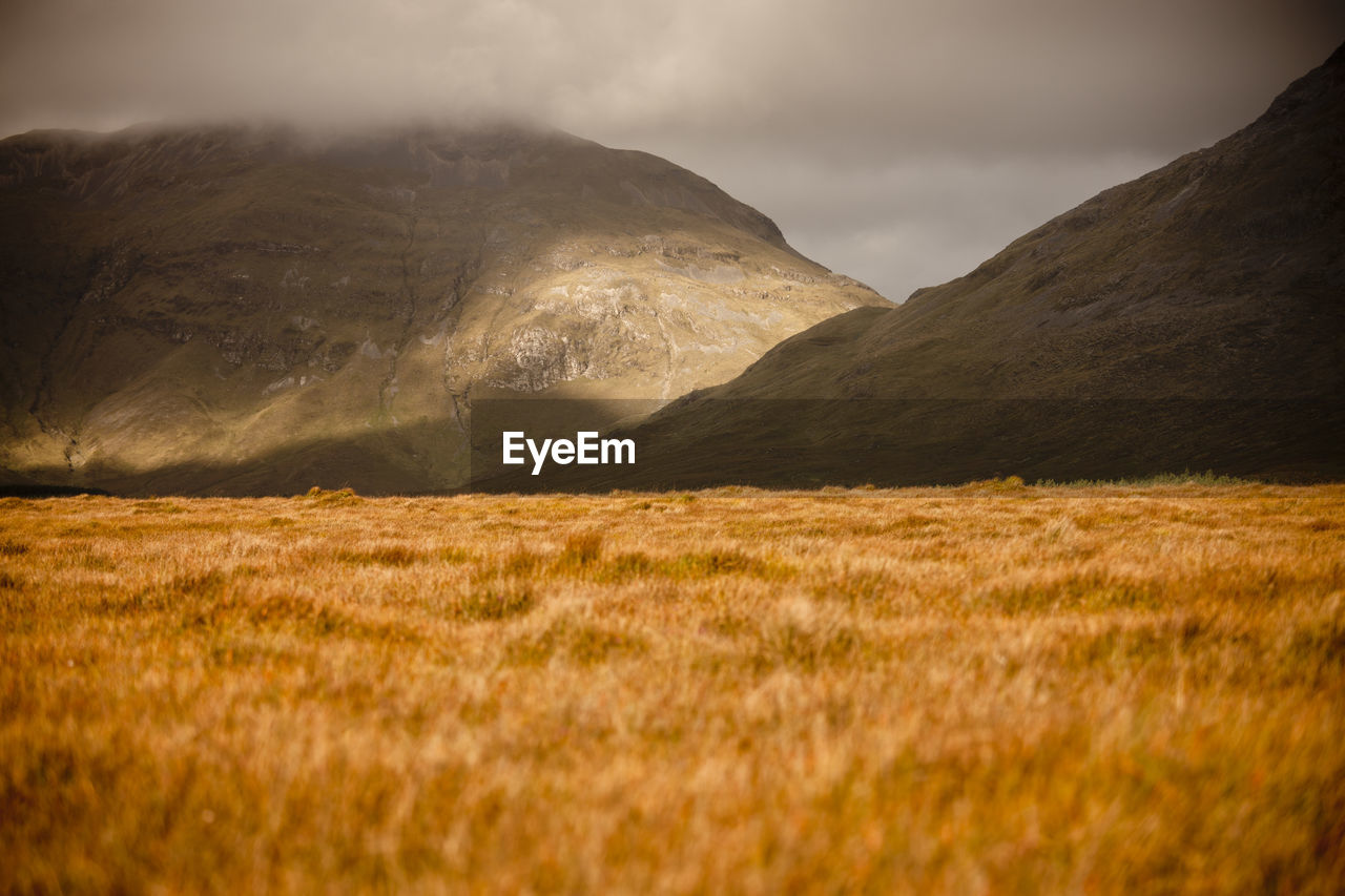 Scenic view of connemara mountains against sky