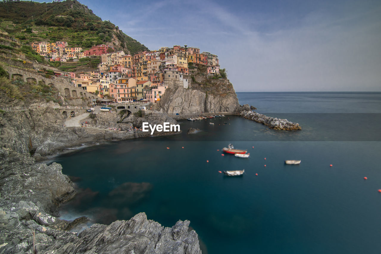 Scenic view of sea and rocks against sky