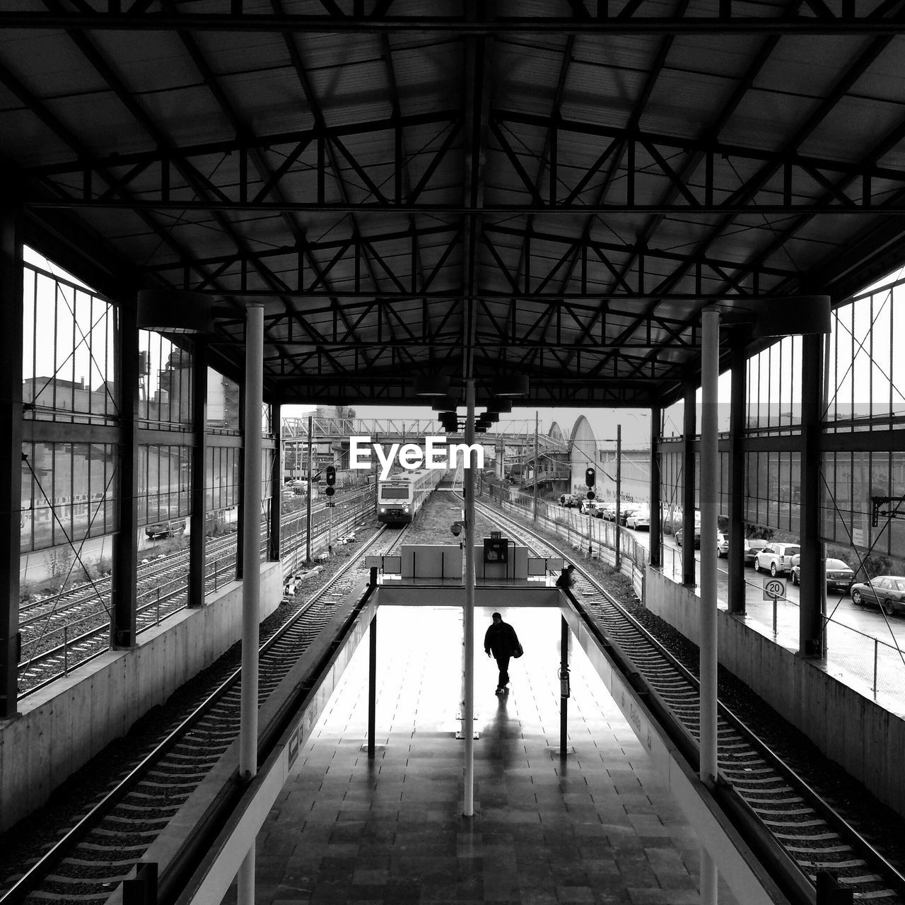 MAN WALKING IN BRIDGE