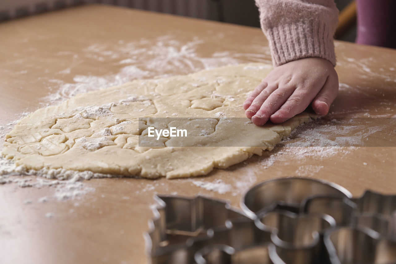 cropped hand of person holding jigsaw pieces