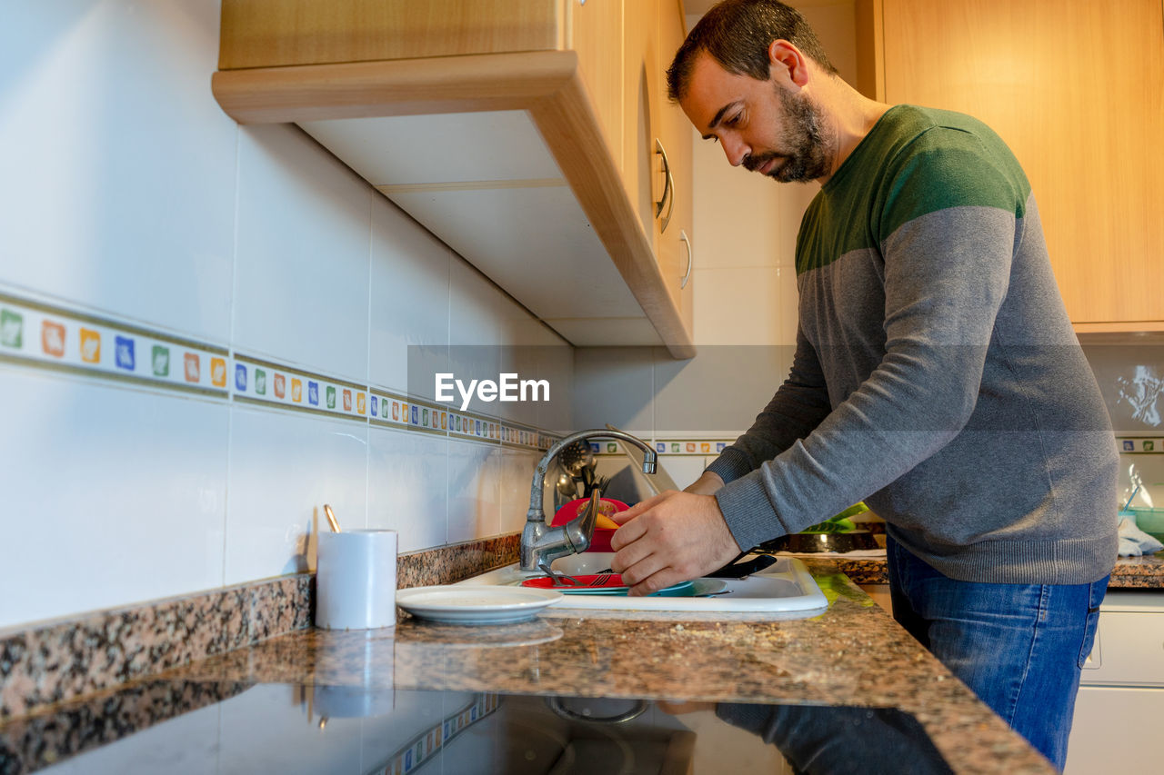 Side view of man working at home