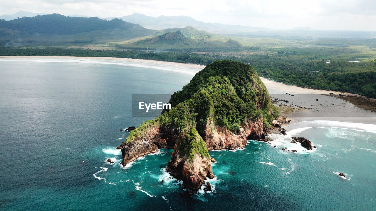 High angle view of mountain on sea against sky