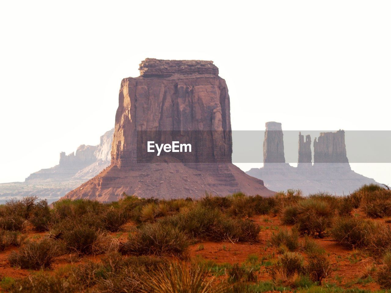 Rock formations on landscape against clear sky