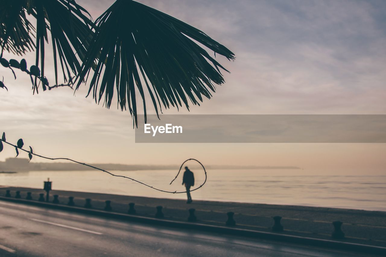 Scenic view of sea against sky at sunset