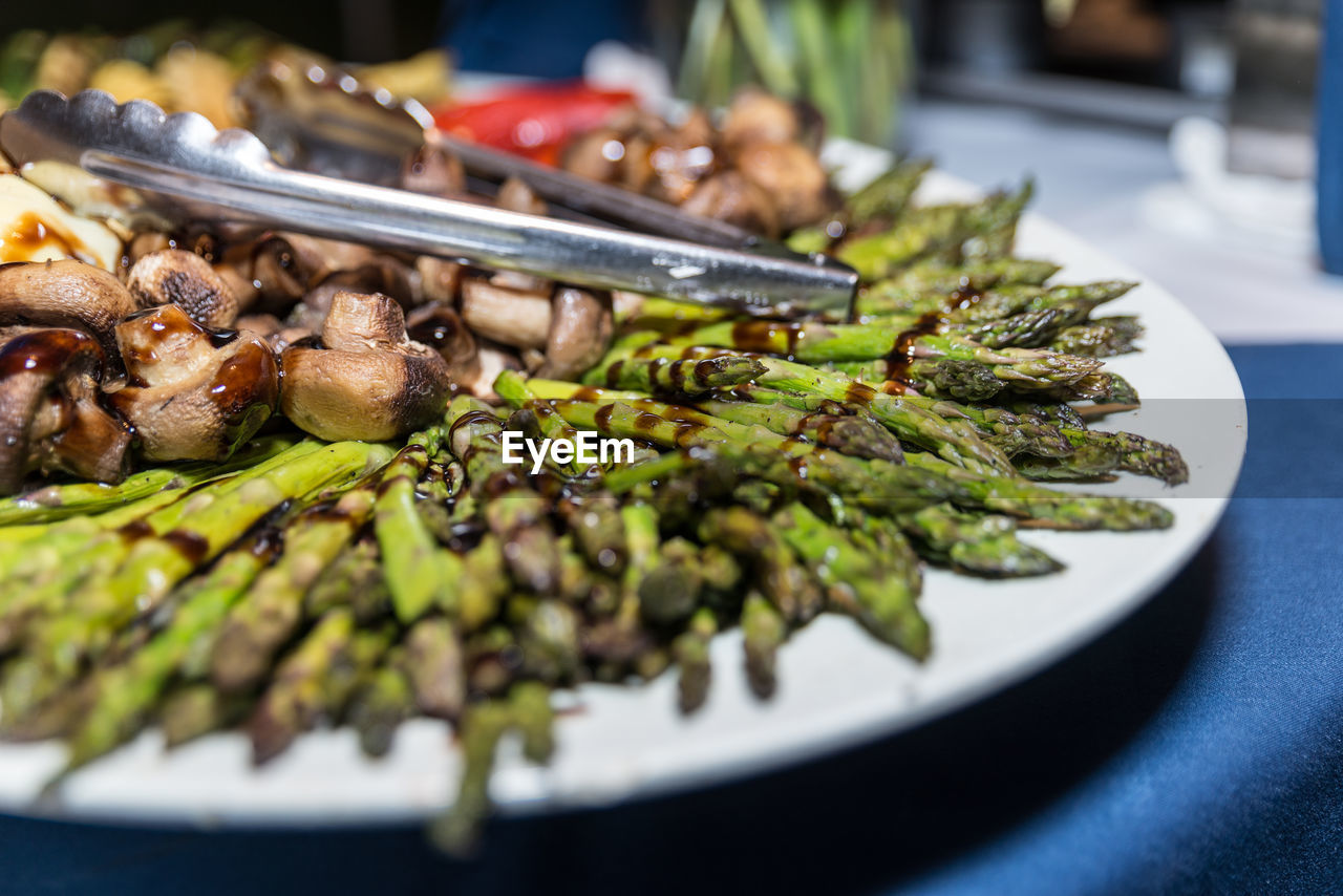 Close-up of roasted vegetables in plate on table