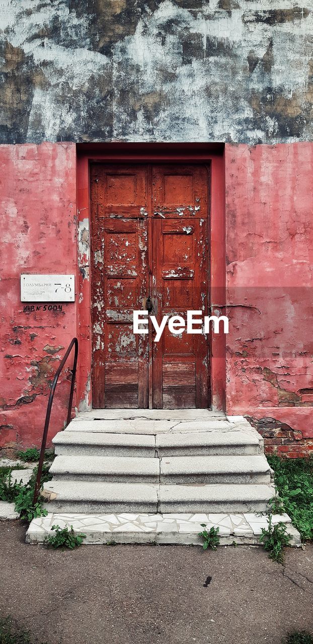 CLOSED DOOR OF OLD HOUSE