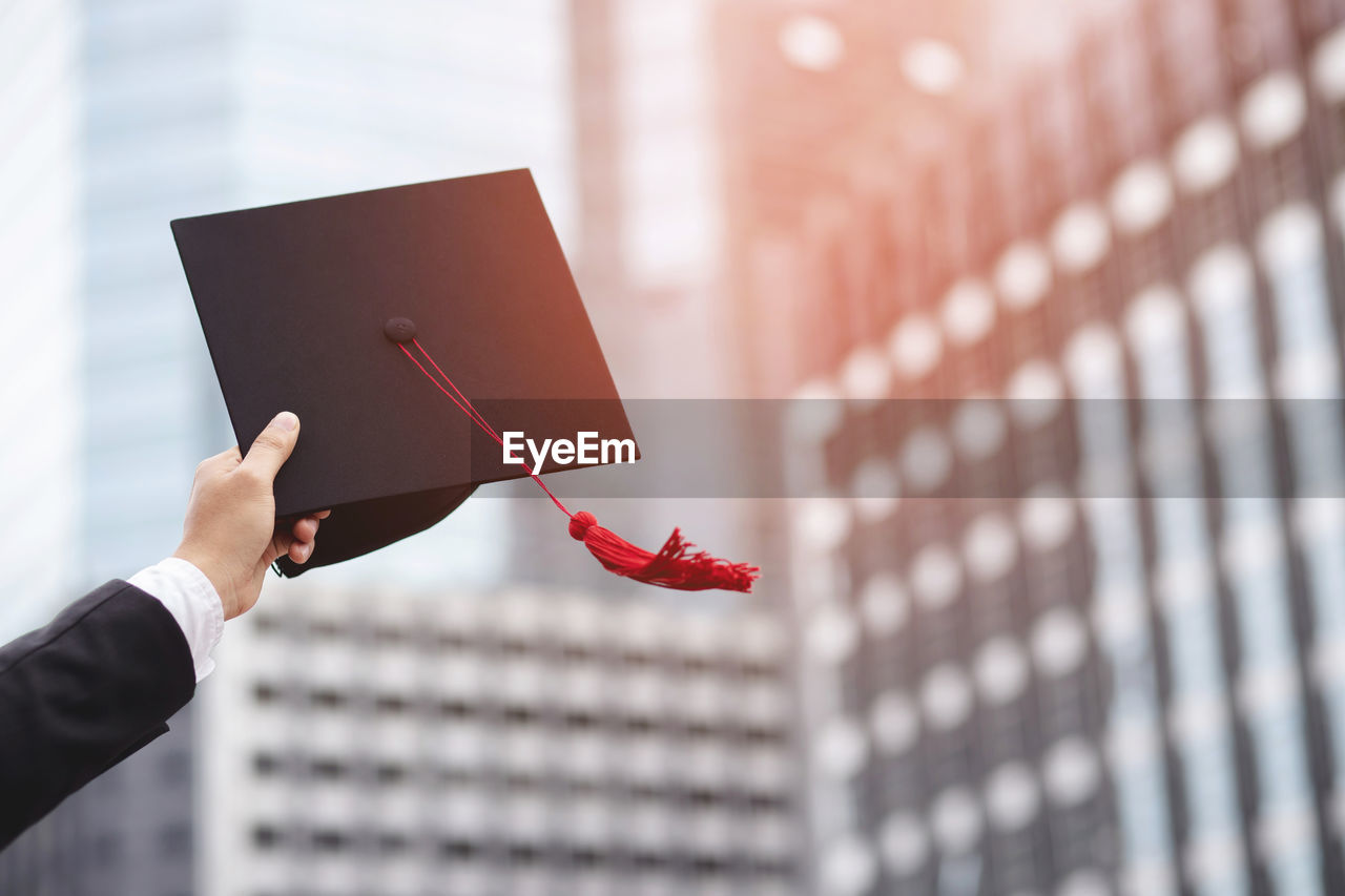 Shot of graduation hats during commencement success graduates 