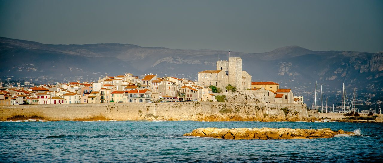 SCENIC VIEW OF VILLAGE AGAINST SKY